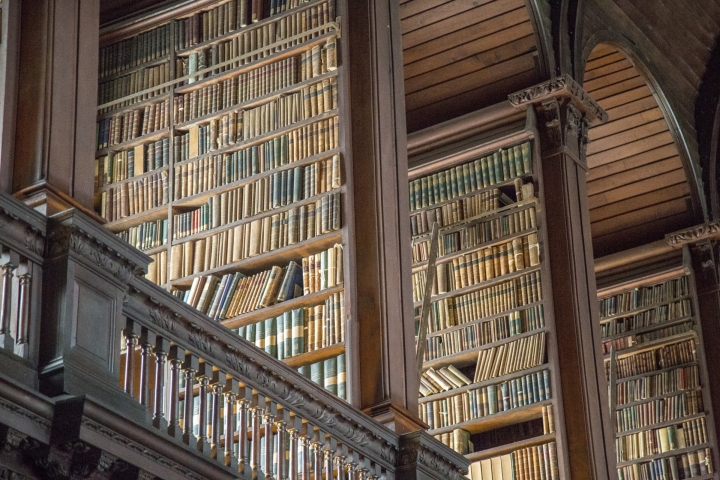 Angled shot of the bookshelves in Trinity College Library.
